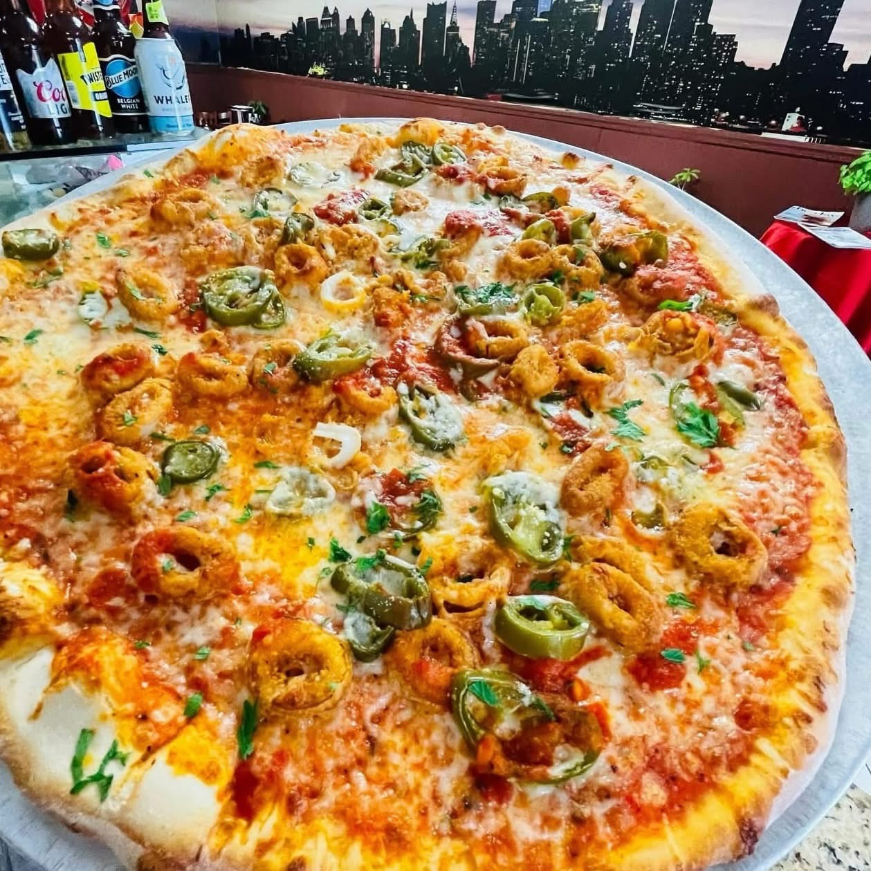 Calamari and jalapeño pizza