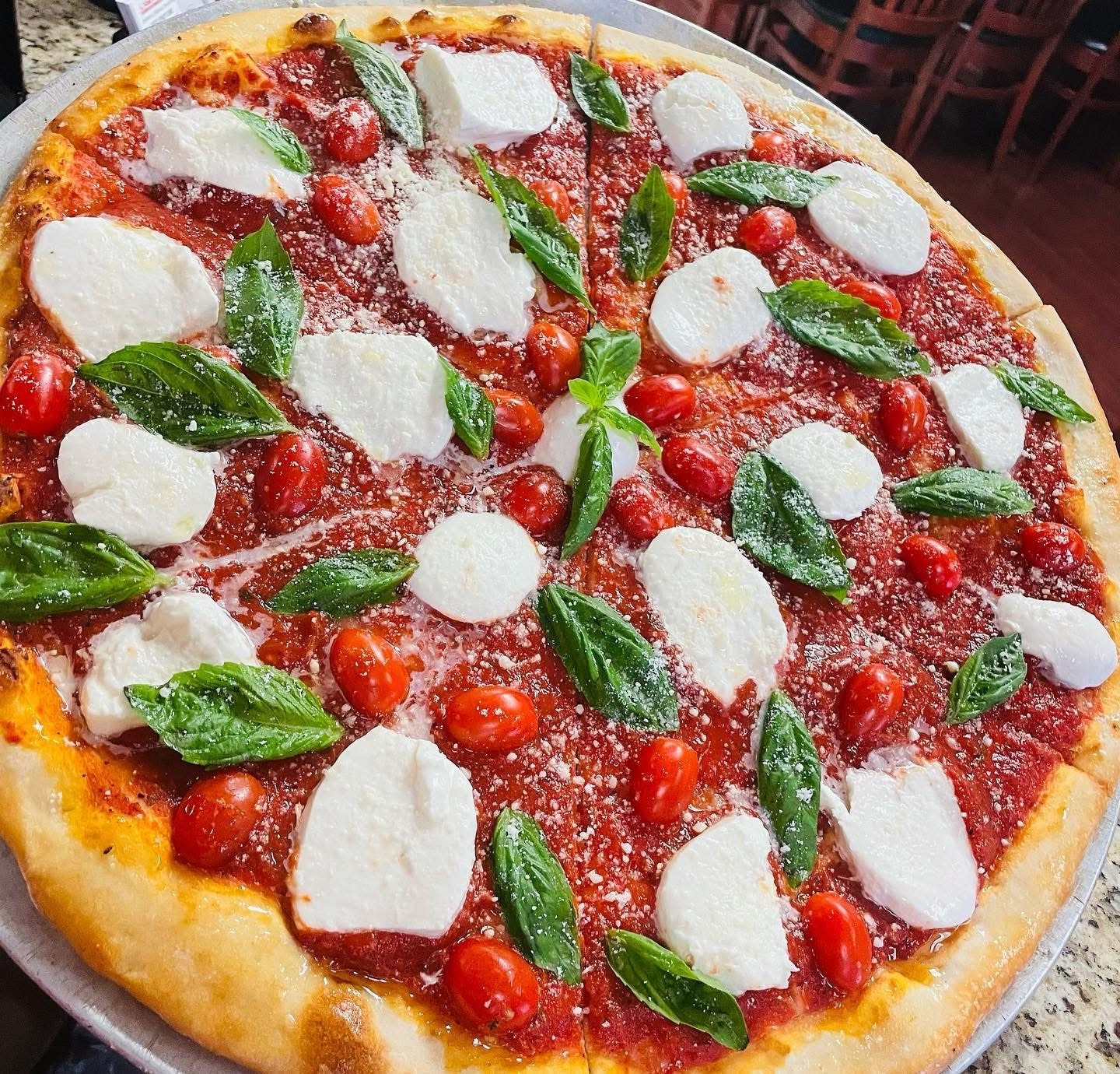 Pizza with fresh mozzarella and basil